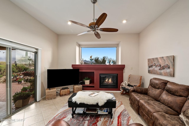 tiled living room featuring ceiling fan