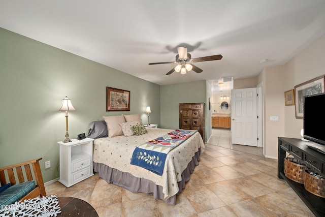 tiled bedroom with ensuite bathroom and ceiling fan