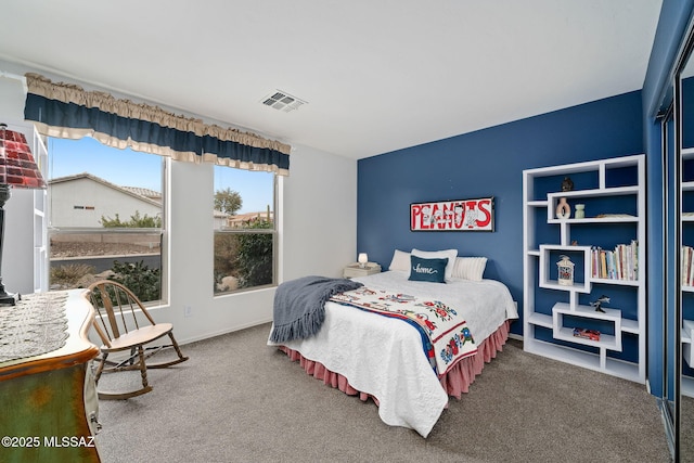 bedroom with lofted ceiling and carpet floors