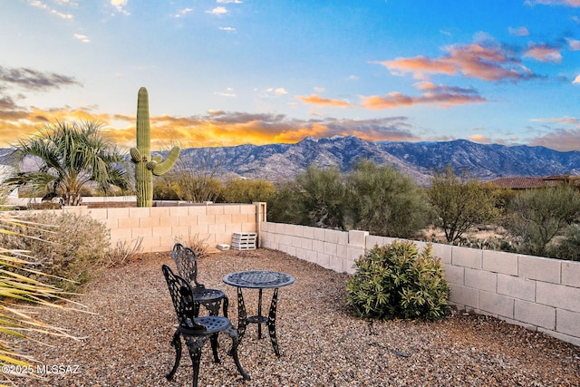 yard at dusk with a mountain view