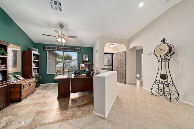 home office featuring light tile patterned flooring, lofted ceiling, and ceiling fan