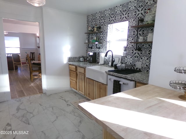 kitchen with dishwasher, sink, and ornamental molding