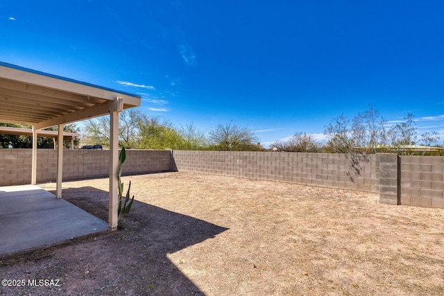 view of yard with a fenced backyard and a patio area