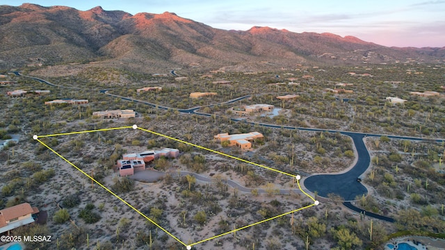 aerial view at dusk with a mountain view