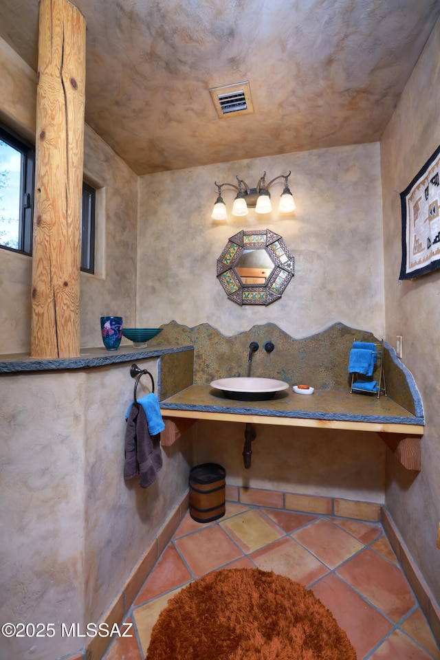 bathroom with tile patterned flooring and sink