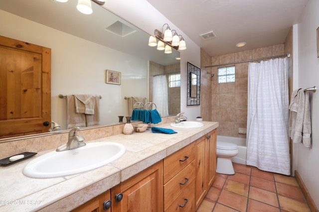 full bathroom with vanity, tile patterned floors, toilet, and shower / bath combo