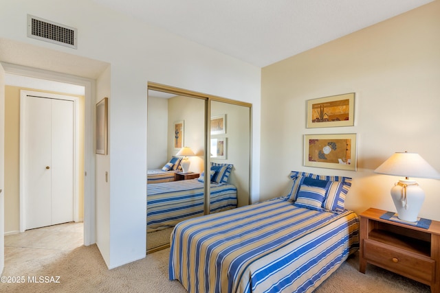 carpeted bedroom with a closet