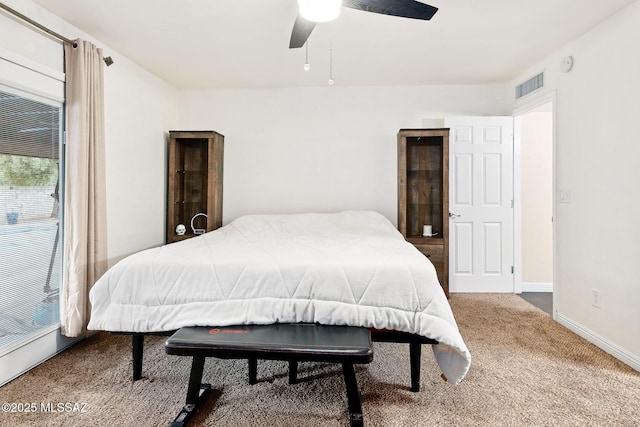 bedroom with ceiling fan and carpet flooring