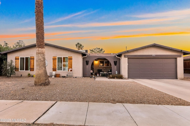 single story home with a garage