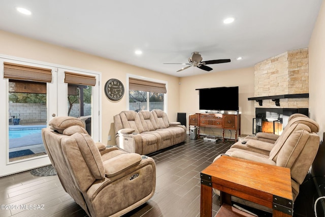 living room featuring dark hardwood / wood-style floors, ceiling fan, and french doors