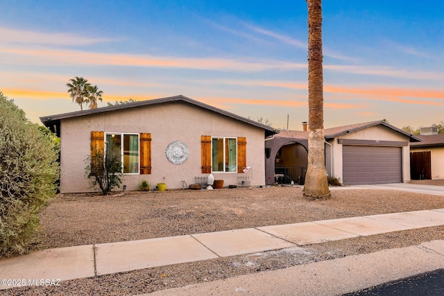 ranch-style home with a garage