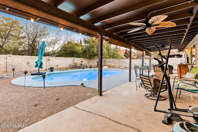 view of pool with a patio area and ceiling fan