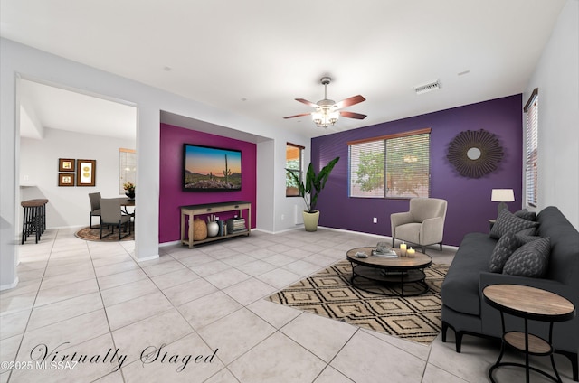 living room featuring ceiling fan and light tile patterned floors