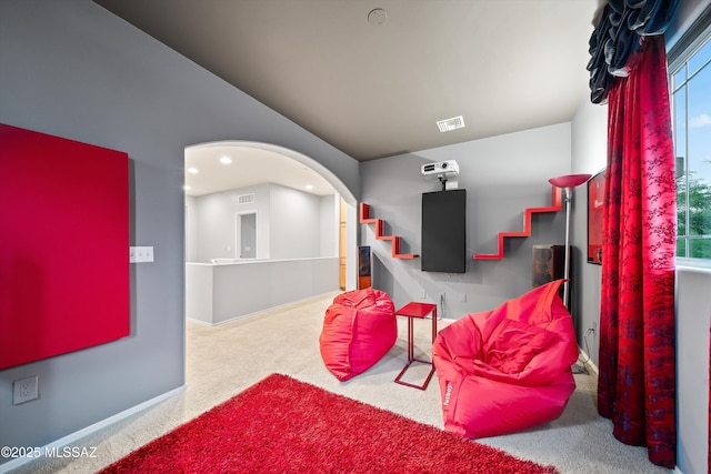 living area featuring carpet