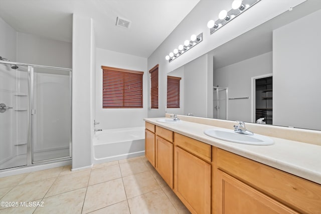 bathroom with vanity, tile patterned floors, and independent shower and bath