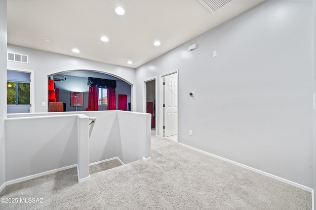 hall with light carpet