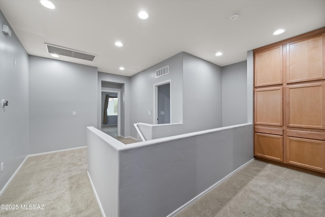hallway with light carpet