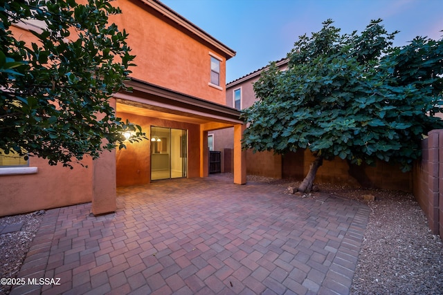 view of patio terrace at dusk