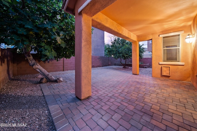 view of patio terrace at dusk