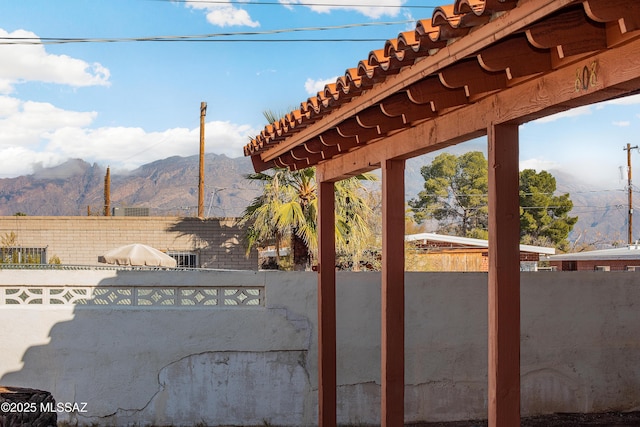 view of patio with area for grilling and a mountain view