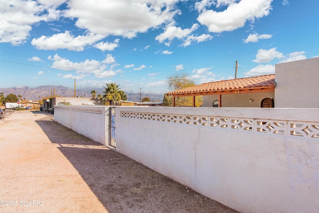 view of property exterior featuring a mountain view