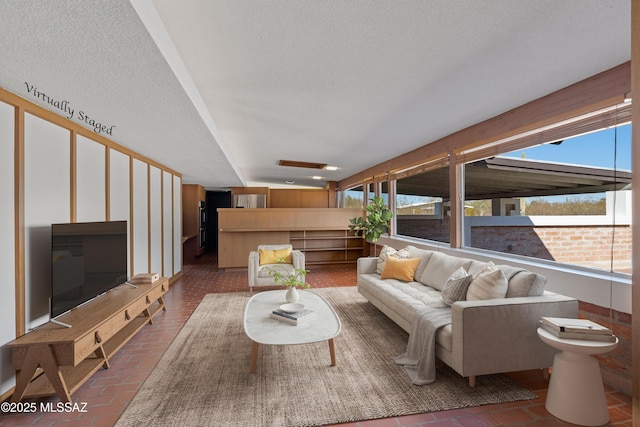 living room with a textured ceiling