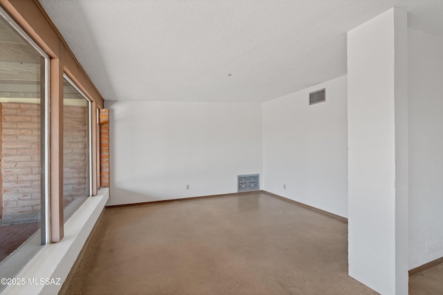 empty room featuring a textured ceiling