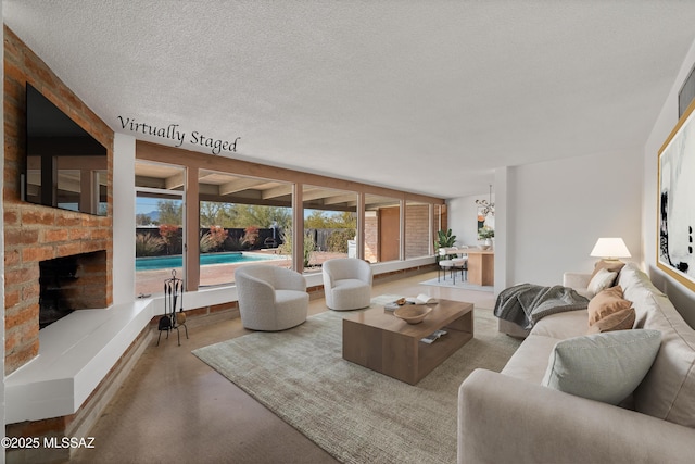 living room with a textured ceiling and concrete floors