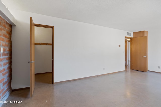 spare room featuring a textured ceiling