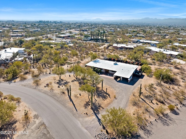 birds eye view of property with a mountain view