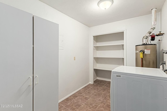 laundry area with laundry area, washer / clothes dryer, baseboards, and water heater