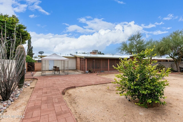 exterior space with a patio and fence