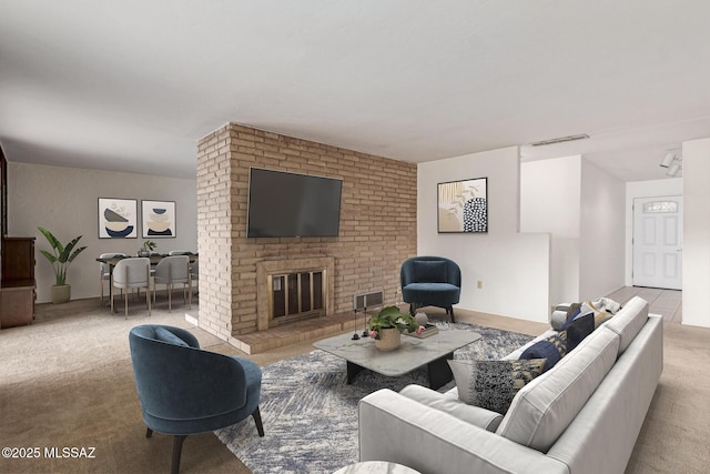 carpeted living area featuring a fireplace and visible vents