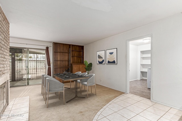 dining area featuring light carpet
