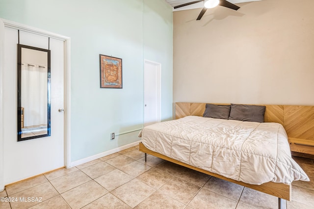 bedroom featuring light tile patterned floors and ceiling fan