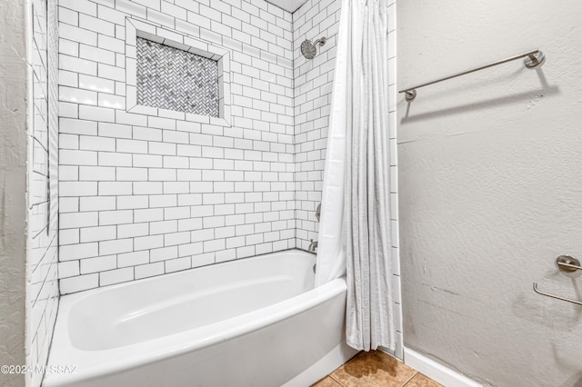 bathroom featuring shower / tub combo and tile patterned floors