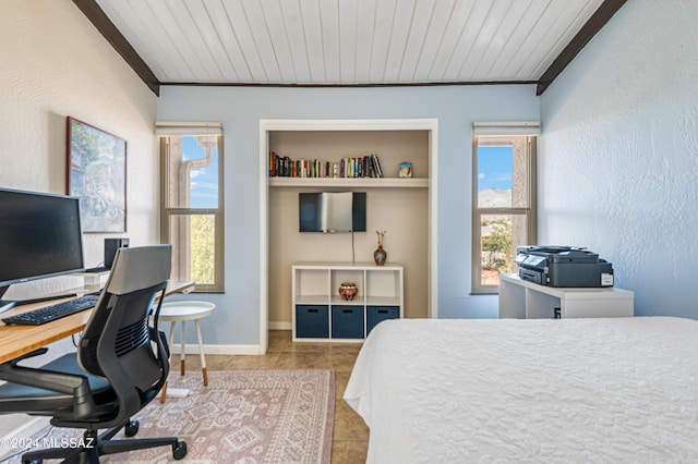 bedroom featuring multiple windows, light tile patterned flooring, and wood ceiling