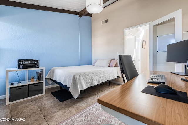 bedroom with beam ceiling