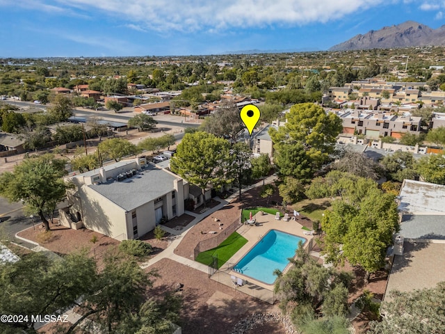 birds eye view of property featuring a mountain view