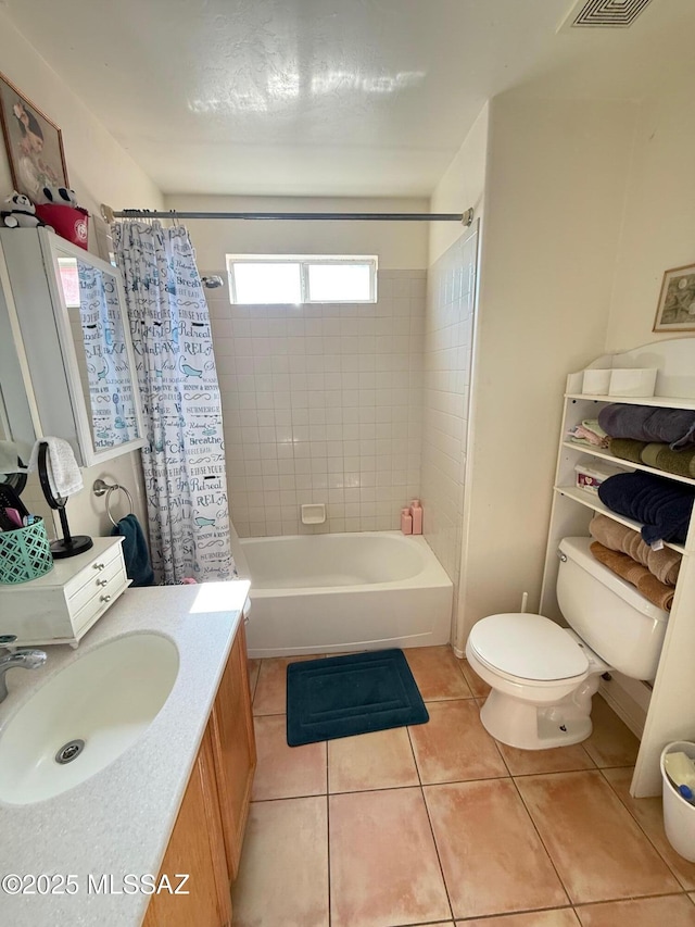 full bathroom with shower / bath combination with curtain, vanity, toilet, and tile patterned flooring