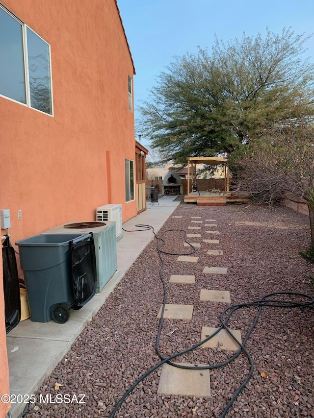 view of yard with a patio area and ac unit