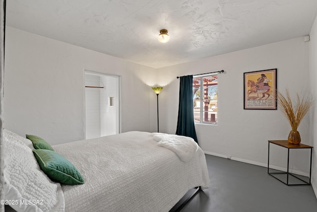 bedroom featuring concrete floors