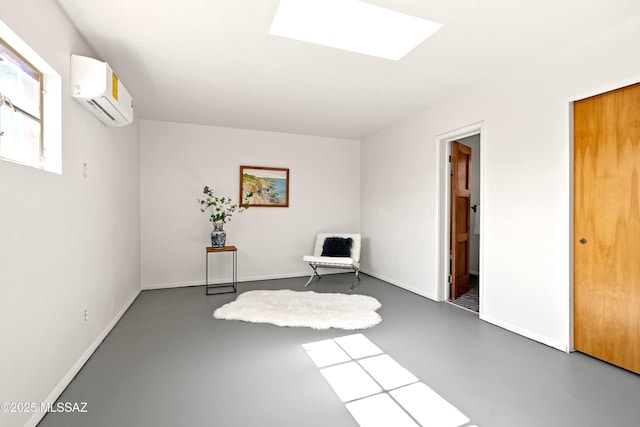 unfurnished room featuring a wall mounted air conditioner and a skylight