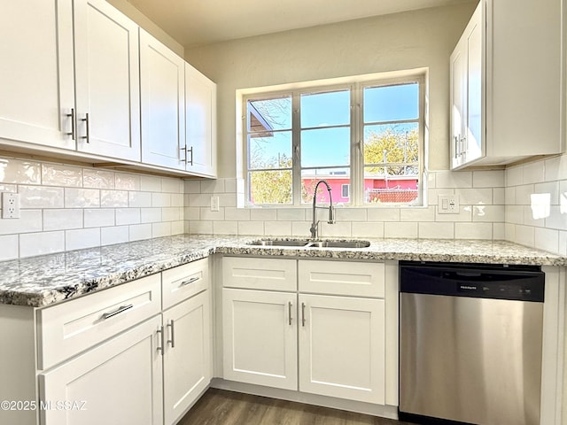 kitchen featuring white cabinetry, dishwasher, sink, and light stone counters