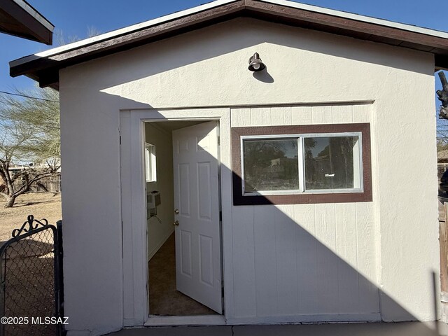 view of home's exterior with a sunroom