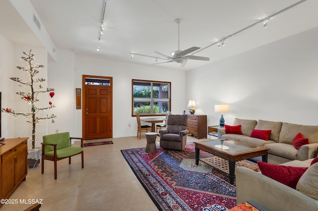 living room with ceiling fan and rail lighting