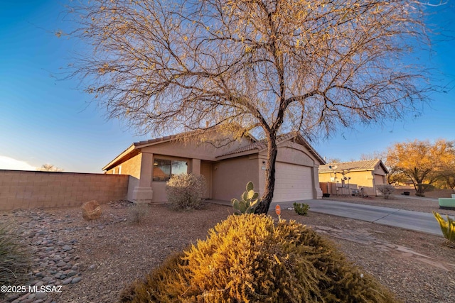 view of front of home with a garage