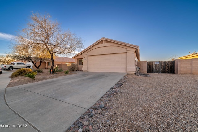 ranch-style home featuring a garage