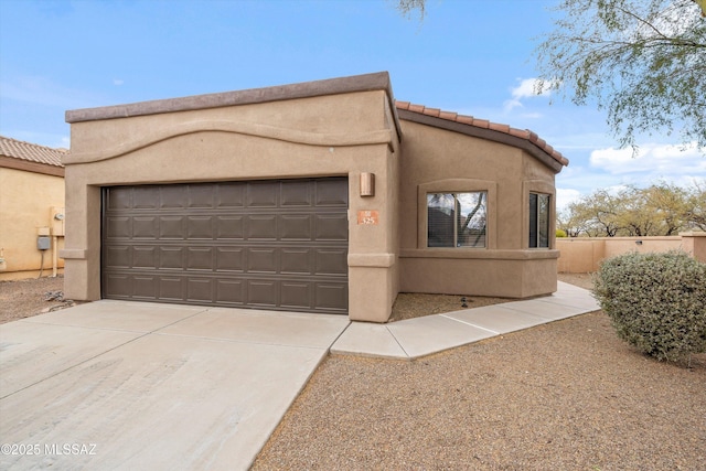 adobe home featuring a garage