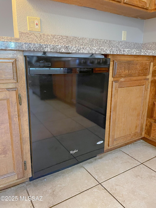 interior details with light stone counters and dishwasher